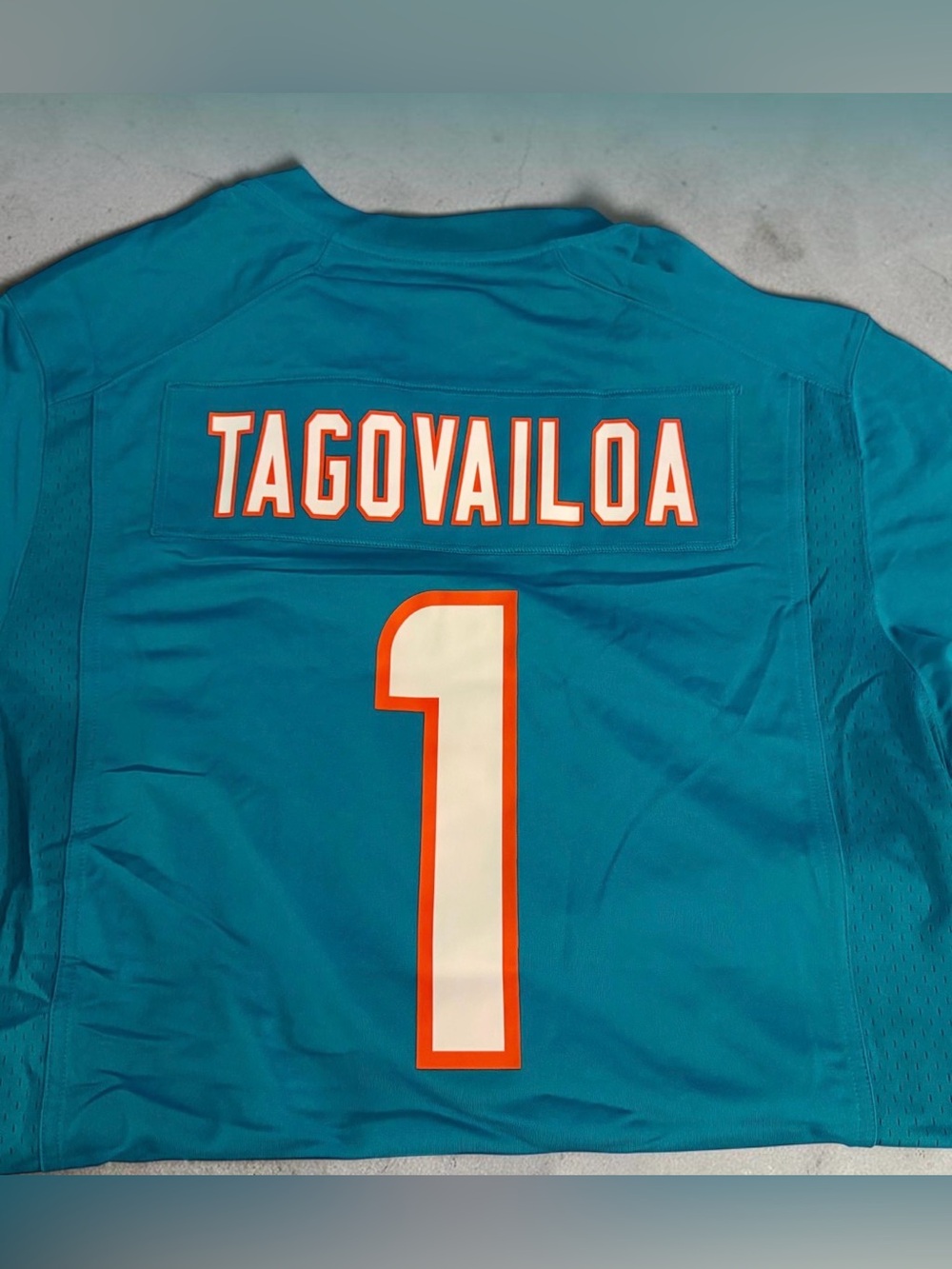 NFL Tua Tagovailoa Dolphins Teal Jersey with White and Orange Details